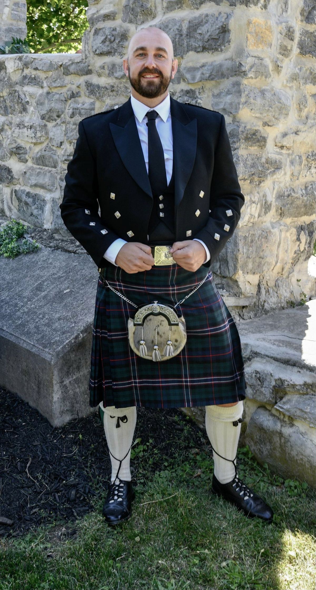 Fraser Murdoch in full Highland dress for a Scottish wedding ceremony